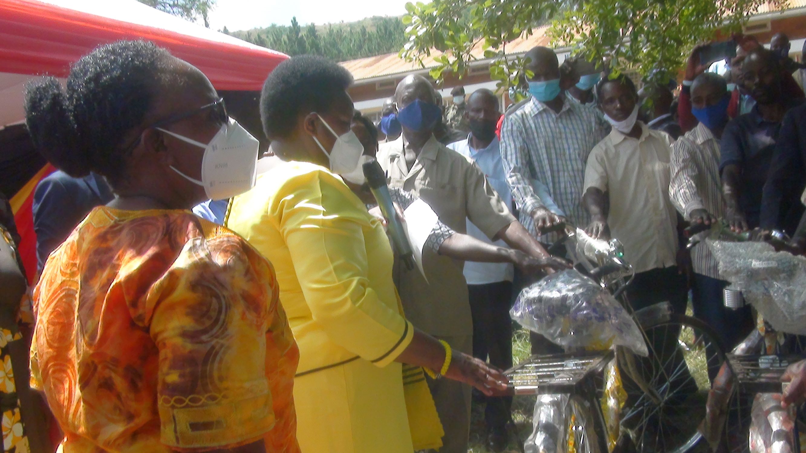 Minister for local government Hon Rusoke victoria handing over the bicyles to village and parish chairpersons 